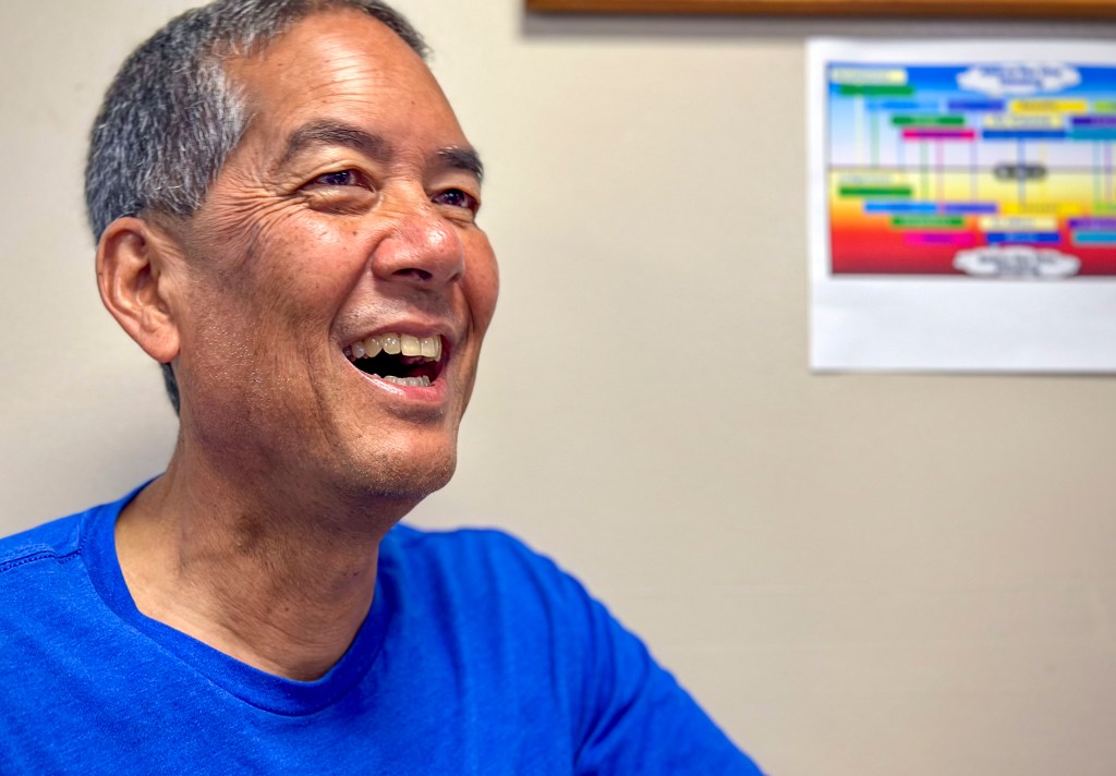 Randy Kosaki, 62, smiled as colleagues and crew sang "Happy Birthday" to him during dinner on board the Oscar Elton Sette. He's rarely celebrated his birthday (or his wife's) at home on Oʻahu over the past 20 years as the research cruises often happen in Septemer. (Nathan Eagle/Civil Beat/2024)