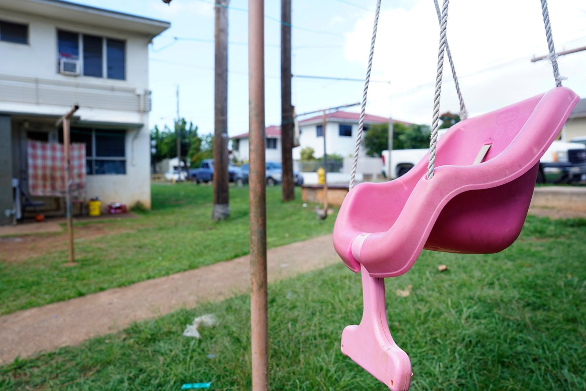 The child who plays in this swing soon will be forced to find a new home, photographed Monday, Feb. 24, 2025, in Honolulu. These Kūhiō Park Terrace buildings are slated for demolition to clear land for a new and larger affordable hosing complex. (Kevin Fujii/Civil Beat/2025)
