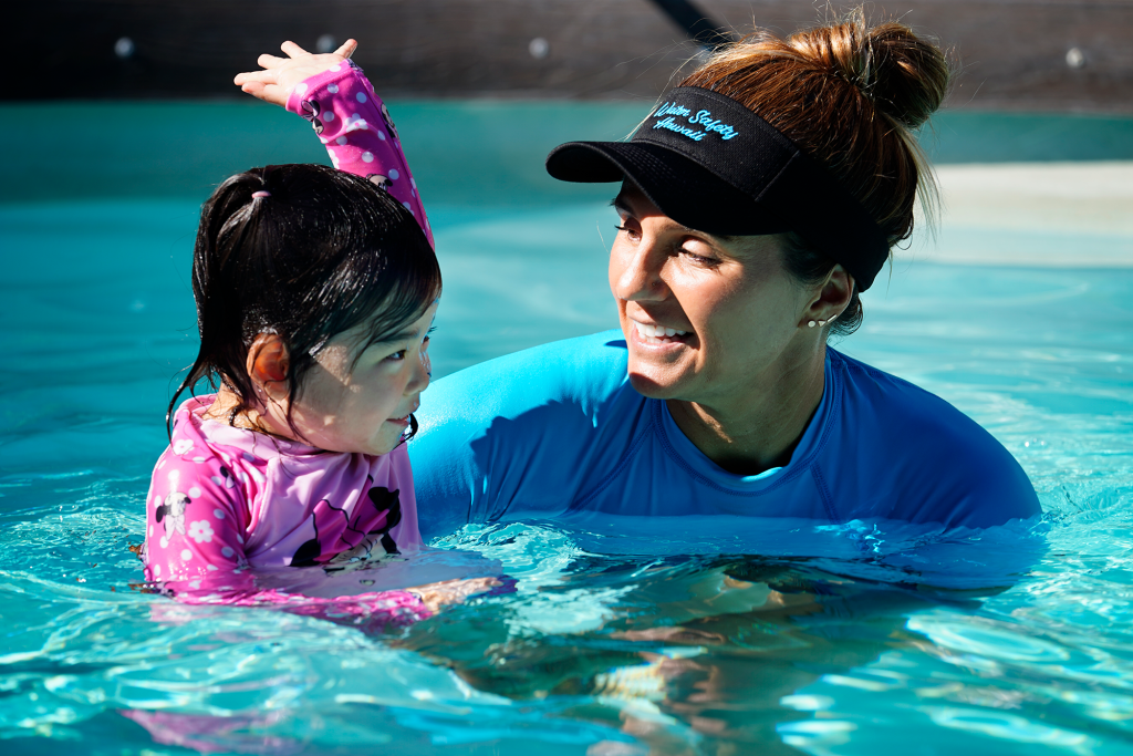 Kira Kawaoka, 3, shows instructor Audrey Harrer her big-girl swim stroke during her lesson Tuesday, Feb. 25, 2025, in Waipahu. Water safety is paramount living on an island. (Kevin Fujii/Civil Beat/2025)