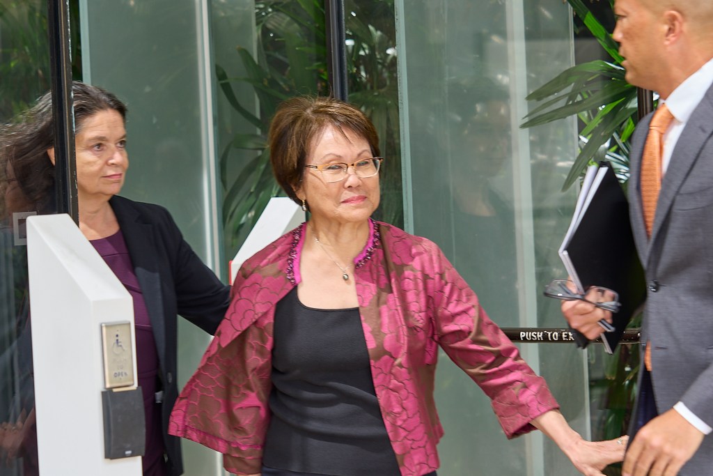 Donna Leong exits US Federal Court in the Prince Kuhio Federal Building Tuesday March 4th, 2025 along with her lawyers Tommy Otake (R) and  Lynn Panagagos (L)(David Croxford/Civil Beat/2025)