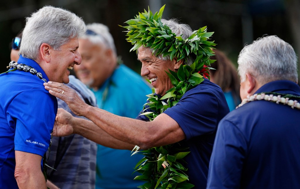 Nainoa Thompson, center, honors former University of Hawai’i president David Lassner, left, and Department of Education superintendent Keith Hiyashi, right, for their contribution to education during the Polynesian Voyaging Society’s Ke Kahua o Hōkūle‘a - The Foundation of Hōkūleʻa -   Thursday, March 6, 2025, in Honolulu. The voyaging wa’a (canoe) Hōkūle’a celebrates its 50th year. (Kevin Fujii/Civil Beat/2025)