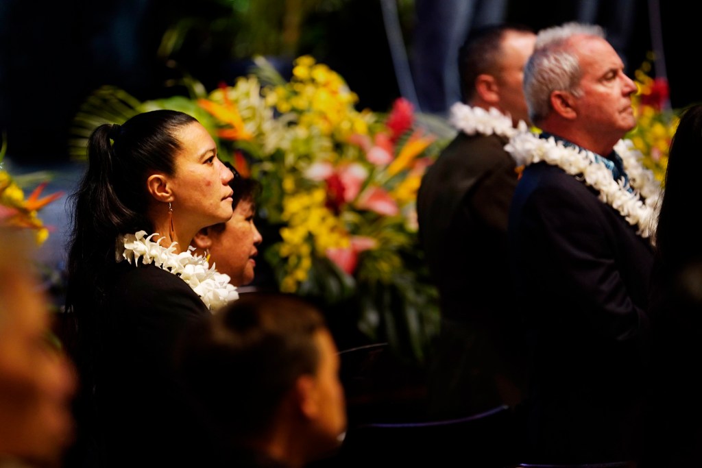 Maui County Council member Keani Rawlins-Fernandez stands for Royal Orders entering the auditorium before Mayor Richard Bissen’s state of the county address Friday, March 7, 2025, in Kahului. (Kevin Fujii/Civil Beat/2025)