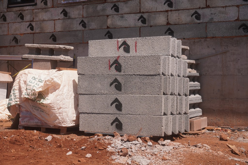 Surf Block Maui is building new homes in the Lahaina Maui fire zone. The main construction elements are insulated composite concrete forms (ICCFs) similar to regular blocks but made from reconstituted waste surf board material.  Photographed March 14th, 2025 at 305 Luawai Street, Lahaina (Courtesy Photo/Civil Beat/2025)