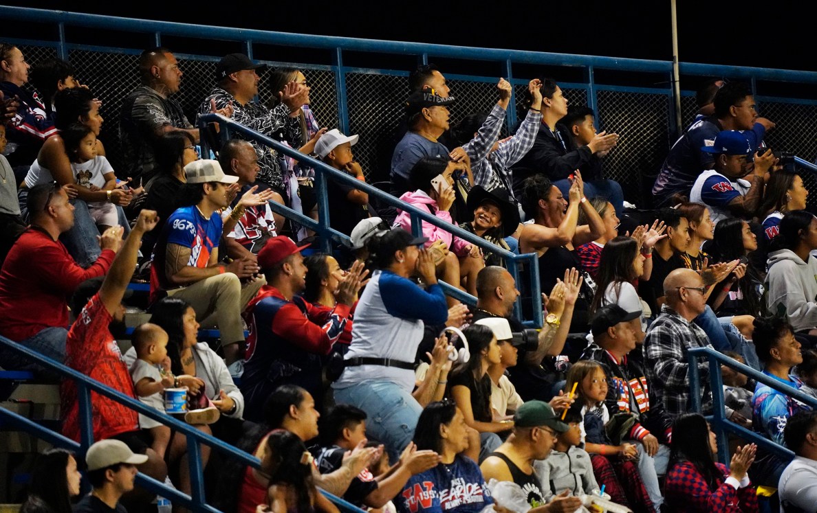 Wai’anae High School fans cheer for the Seariders’ first touchdown against Nanakuli Tuesday, March 25, 2025, at Raymond Torii Field in Wai’anae. (Kevin Fujii/Civil Beat/2025)