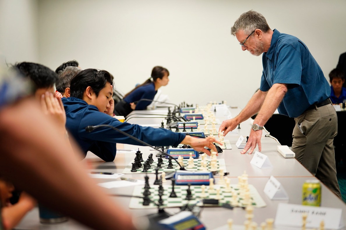 National Master Cornelius Rubsamen simultaneously plays 20 people at the Art at the Capitol event Friday, April 11, 2025, in Honolulu. The theme for this year’s event is ‘Kālena, the Talent of Hawai‘i.’ (Kevin Fujii/Civil Beat/2025)