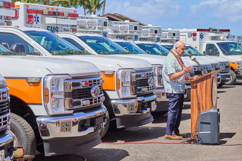 On Tuesday May 7th, Honolulu Mayor Rick Blangiardi, a number of Honolulu Council members and several EMS leaders gathered at Keehi Beach Park to partake in an Hawaiian blessing.  The blessing was for a group of 17 new emergency response vehicles that will be positioned across O’ahu within the month of May.  The units  include 14 EMS Ambulances, 2 C.O.R.E rigs and an AmbuBus that can support mass casualty events and evacuations.  Another 4 additional Ambulances will arrive in the Fall, completing the largest one time deployment of emergency vehicles(David Croxford/Civil Beat/2025)