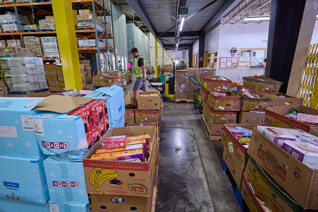 Views of the Hawaii Food Bank which delivers all manner of foods to many individuals and families from their warehouse on Kilihau Street. (David Croxford/Civil Beat/2025)
