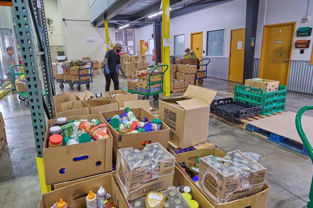 Views of the Hawaii Food Bank which delivers all manner of foods to many individuals and families from their warehouse on Kilihau Street. (David Croxford/Civil Beat/2025)