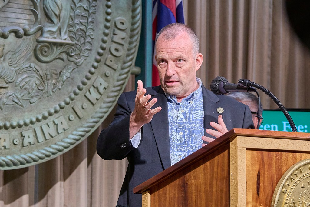 Hawaii Governor Josh Green signed a first in the Nation climate bill that initiates a 0.75% fee upon tourist spending in Hawaii(David Croxford/Civil Beat/2025)