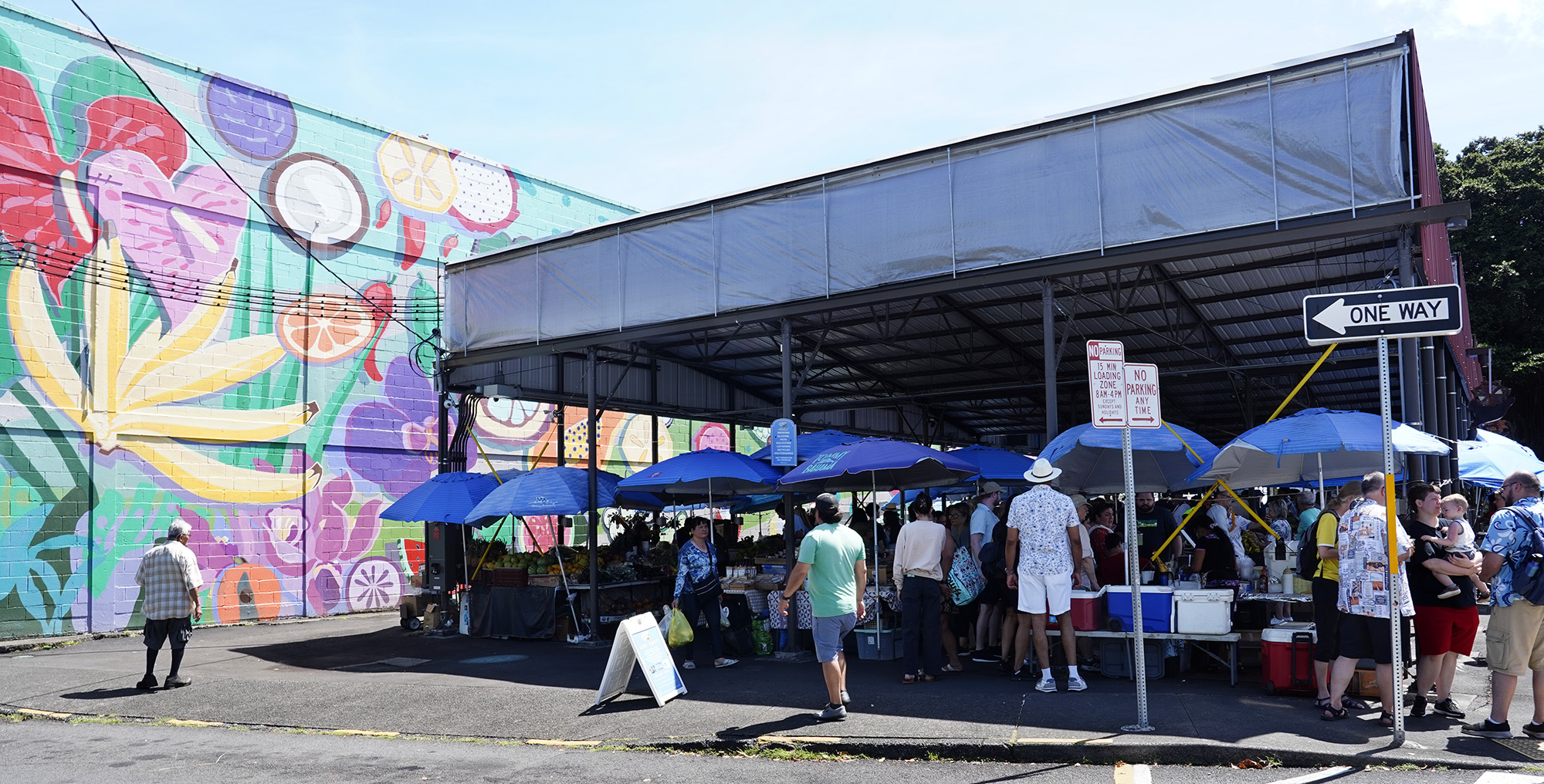 The produce and food section of the Hilo Farmer’s Market is photographed Saturday, May 31, 2025, in Hilo. The bi-weekly outdoor market hosts up to 200 vendors selling artisanal crafts, foods and produce. (Kevin Fujii/Civil Beat/2025)