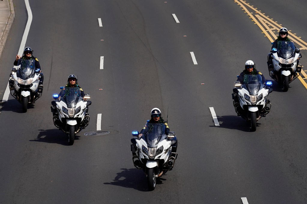 The Honolulu Police Department motorcycle unit’s Flying Wedge leads the 108th King Kamehameha Celebration Floral Parade Saturday, June 14, 2025, in Honolulu. In its 153 year, the King Kamehameha Day Celebrations honor Kamehameha I, the “Father of the Hawaiian Kingdom,” who united the Hawaiian Islands under one rule. His great-grandson King Kamehameha V established King Kamehameha Day in 1971. It was first observed on June 11, 1872. (Kevin Fujii/Civil Beat/2025)