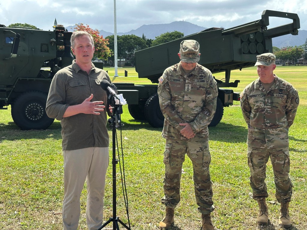 U.S. Army Secretary Daniel P. Driscoll, left, speaks to journalists while standing next to Army Chief of Staff Gen. Randy A. George, center, and Maj. Gen. Marcus S. Evans, 25th Infantry Division commander, at Schofield Barracks, Hawaii on Tuesday, July 22, 2025. (AP Photo/Audrey McAvoy)