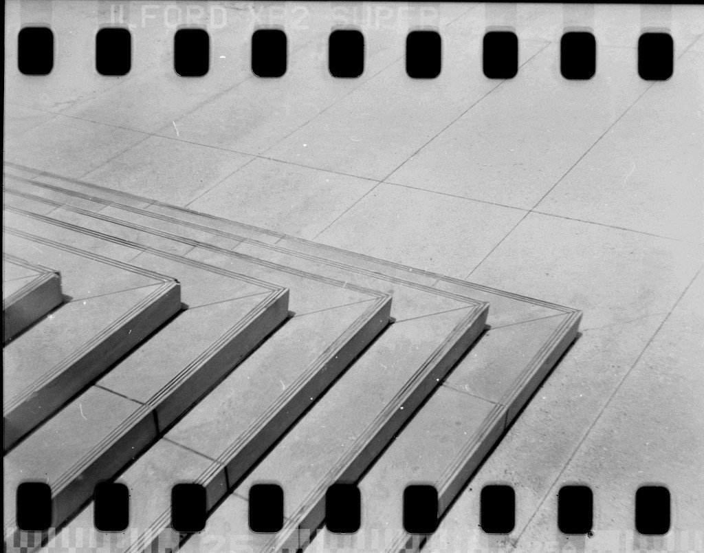 Scenes from outside of the Prince Jonah Kūhiō Kalaniana'ole Federal Building are  photographed with 35mm film inside a Holga 120 Thursday, Aug. 14, 2025, in Honolulu. (Kevin Fujii/Civil Beat/2025)