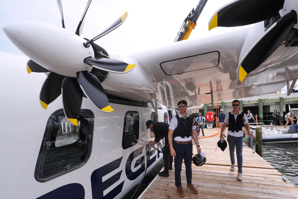 Billy Thalheimer, CEO and Co-Founder of REGENT, left, and Mike Klinker, CTO and Co-Founder of REGENT, walk on a dock after piloting the Viceroy Seaglider, a winged passenger ferry, following a test run on Narragansett Bay, Wednesday, Aug. 6, 2025, in North Kingstown, R.I. (AP Photo/Charles Krupa)