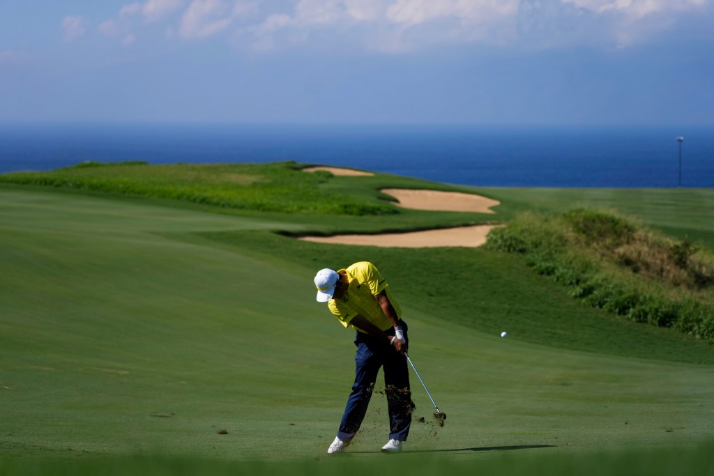 FILE - Hideki Matsuyama, of Japan, hits on the 13th hole during the final round of The Sentry golf event, Jan. 5, 2025, at Kapalua Plantation Course in Kapalua, Hawaii. (AP Photo/Matt York, File)
