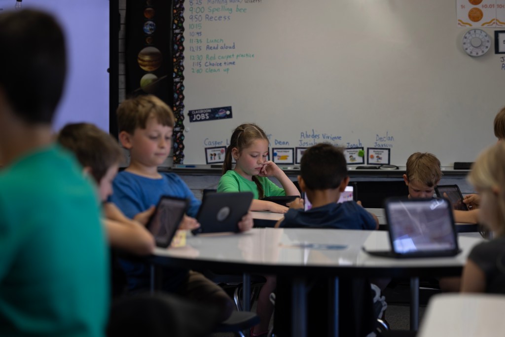 Students work on their tablets in a classroom at Achieve Academy School of Paradise in Paradise on May 21, 2025. Photo by Miguel Gutierrez Jr., CalMatters