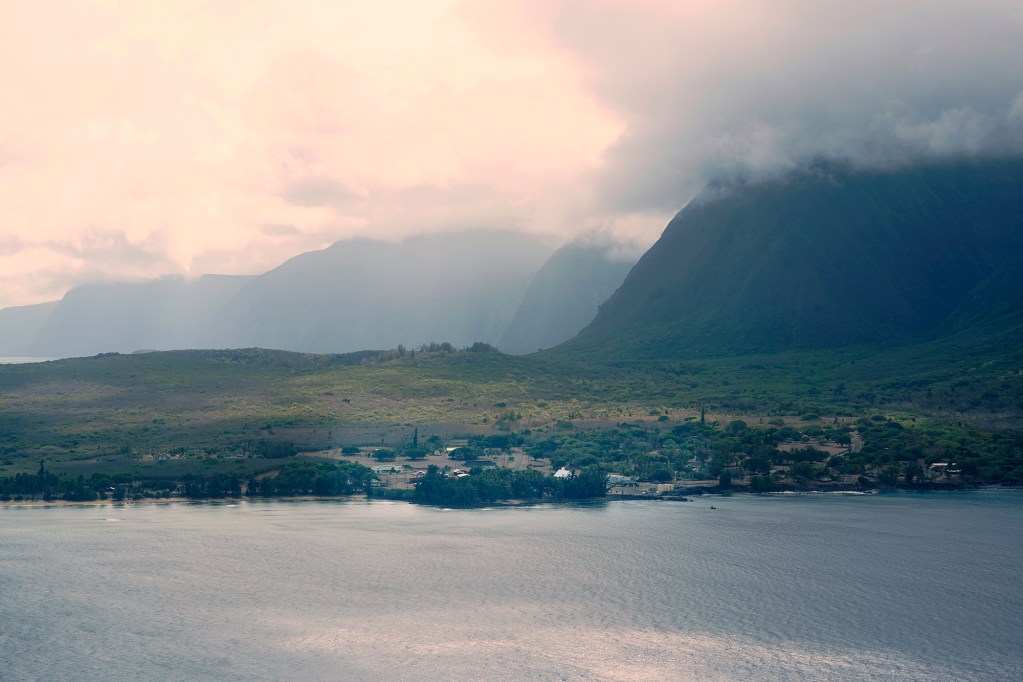 Kalaupapa is seen during the flight’s approach to the airport during the Kalaupapa Saints Tour Thursday, Sept. 18, 2025, in Kalaupapa. Covid closed Kalaupapa National Historical Park five years ago. Multiple state and federal agencies coordinated to allow a patient-owned tour company to bring visitors back. (Kevin Fujii/Civil Beat/2025)