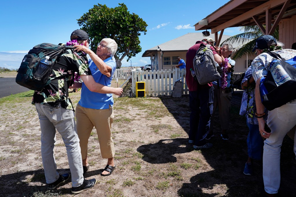 Bryce Moore receives a lei from Sister Barbara Jean Wajda of the Sisters of St. Francis of the Neumann Communities at the beginning of the Kalaupapa Saints Tour for journalists Thursday, Sept. 18, 2025, in Kalaupapa. Mother Marianne  was also a sister of the same order. She was canonized as Saint Marianne Cope in 2012 for her work at Kalaupapa. (Kevin Fujii/Civil Beat/2025)