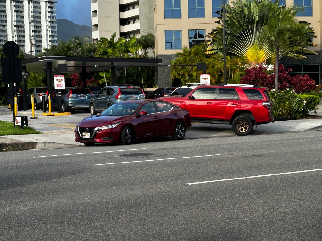 Traffic backs up at the entrance to the drive-through of the Chick-fil-A on Sth. Beretania St.