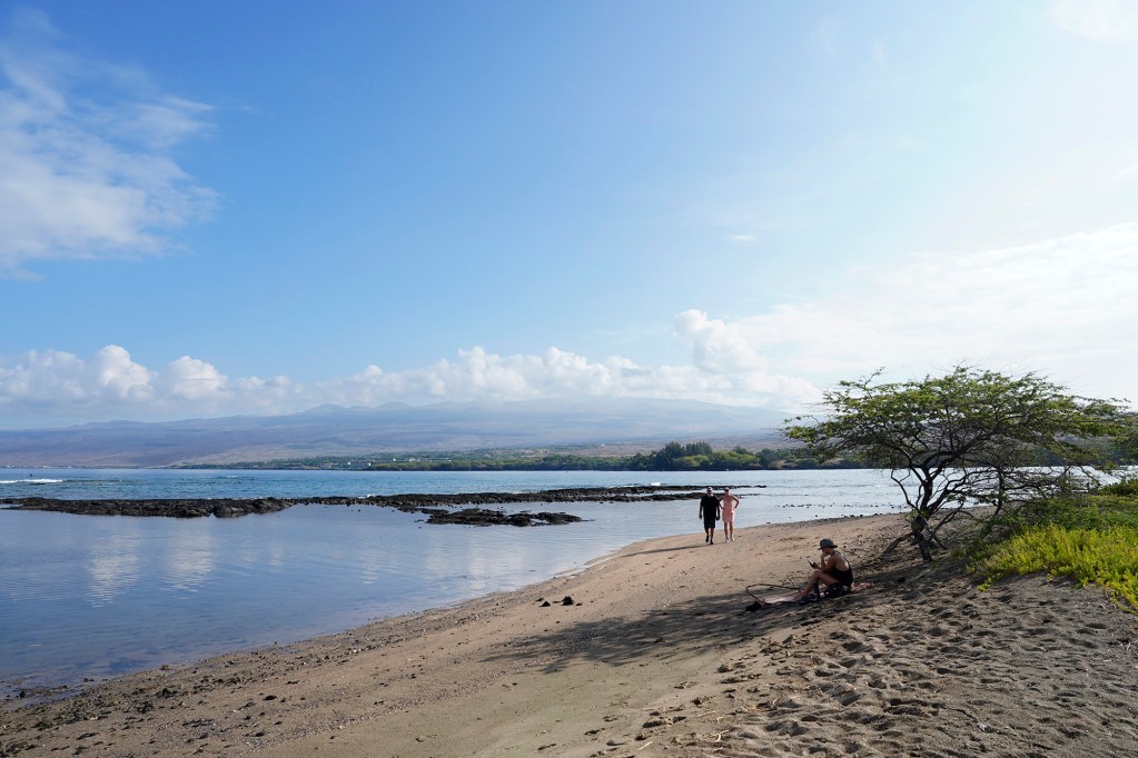Beach goers at Puakō Beach Park enjoy a quiet morning Friday, Oct. 3, 2025, in Waimea. (Kevin Fujii/Civil Beat/2025)