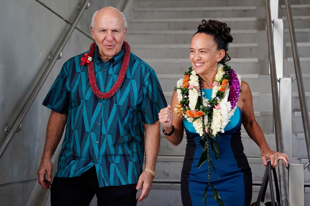 Mayor Rick Blangiardi walks with Lori Kahikina, Executive Director and CEO of the Honolulu Authority for Rapid Transportation (HART), after their inaugural Skyline segment two ride Wednesday, Oct. 15, 2025, in Honolulu. The commuter train now extends past Hālawa Aloha Stadium to Kalihi’s Kahauiki Middle Street Transit Center. (Kevin Fujii/Civil Beat/2025)