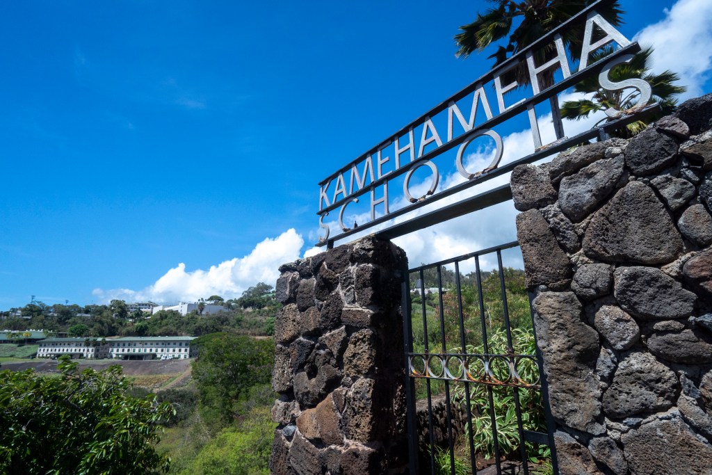 The entrance sign of Kamehameha Schools stands in front of the campus in Honolulu, on Thursday, Sept. 11, 2025. (AP Photo/Mengshin Lin)