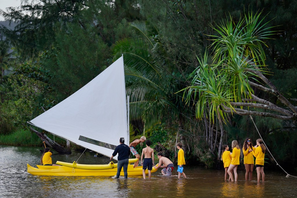 Namahana School students and volunteer take the wa‘a Titarella for an inaugural sail during an ʻāina based learning day at Hanalei Bay Wednesday, Nov. 19, 2025, in Hanalei. (Kevin Fujii/Civil Beat/2025)