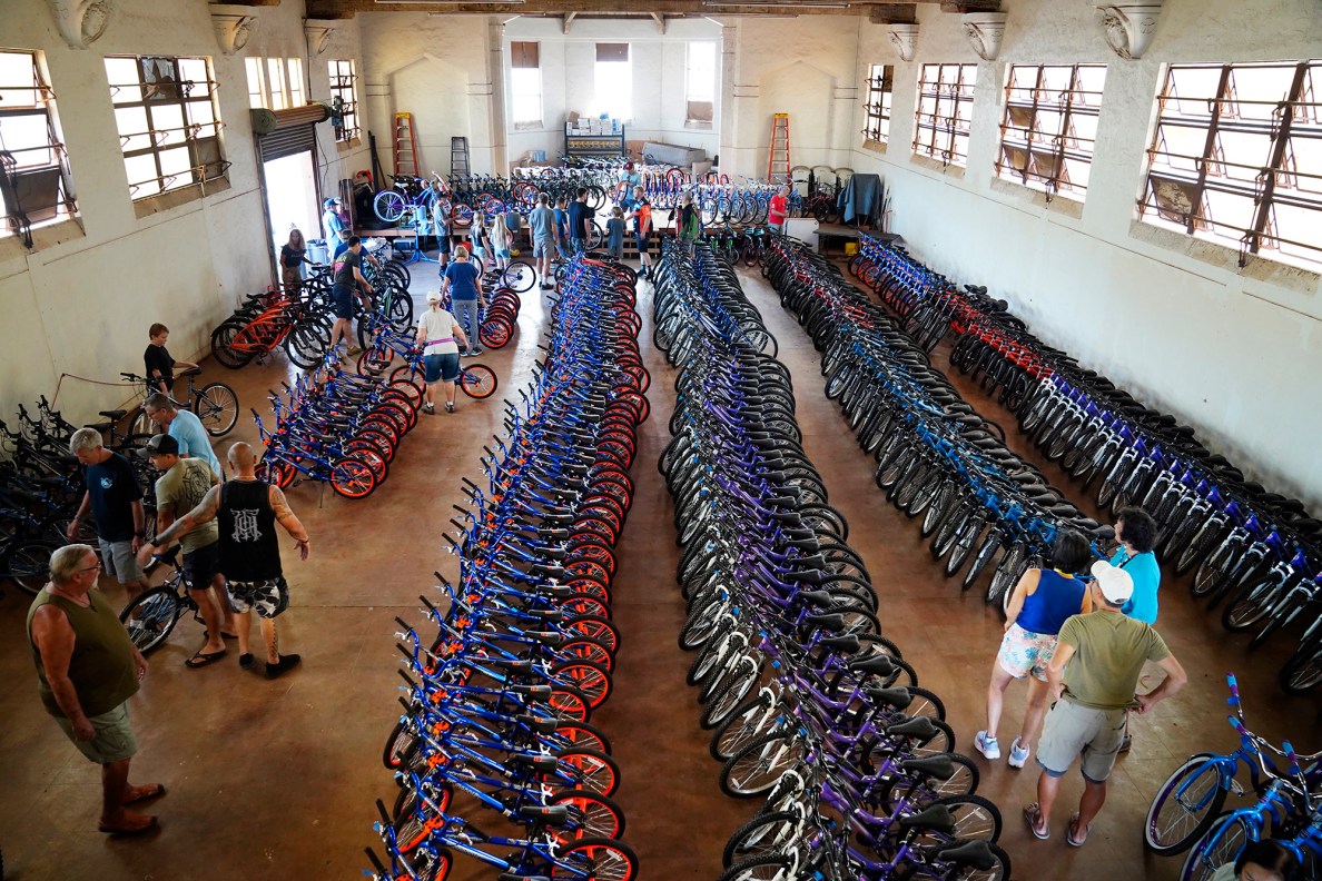 One of four Jim Falk’s annual Christmas Kids Bike Build days takes place Saturday, Dec. 6, 2025, in Puʻunēnē. Approximately 450 new bicycles are built and will distributed to keiki in Maui County. (Kevin Fujii/Civil Beat/2025)