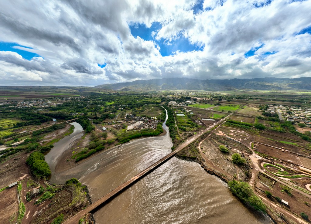 Kaiaka Bay, located on the North Shore of Oʻahu, turns brown after rains wash soil into the waters, Wednesday, Dec. 17, 2025. (Nathan Eagle/Civil Beat/2025)