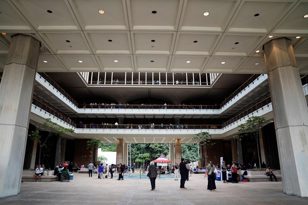 People mill about the Capitol after the Hawaiʻi State Legislature opens Wednesday, Jan. 21, 2026, in Honolulu. (Kevin Fujii/Civil Beat/2026)
