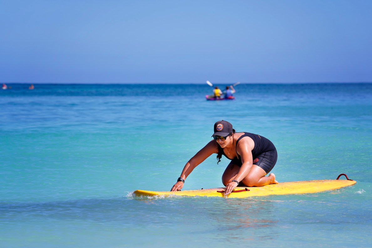 Honolulu Ocean Safety Departmen Lt. Chelsea Kahalepauole-Bizik paddles in during a fitness break at Kailua Beach Park Tuesday, Jan. 27, 2026, in Kailua. (Kevin Fujii/Civil Beat/2026)