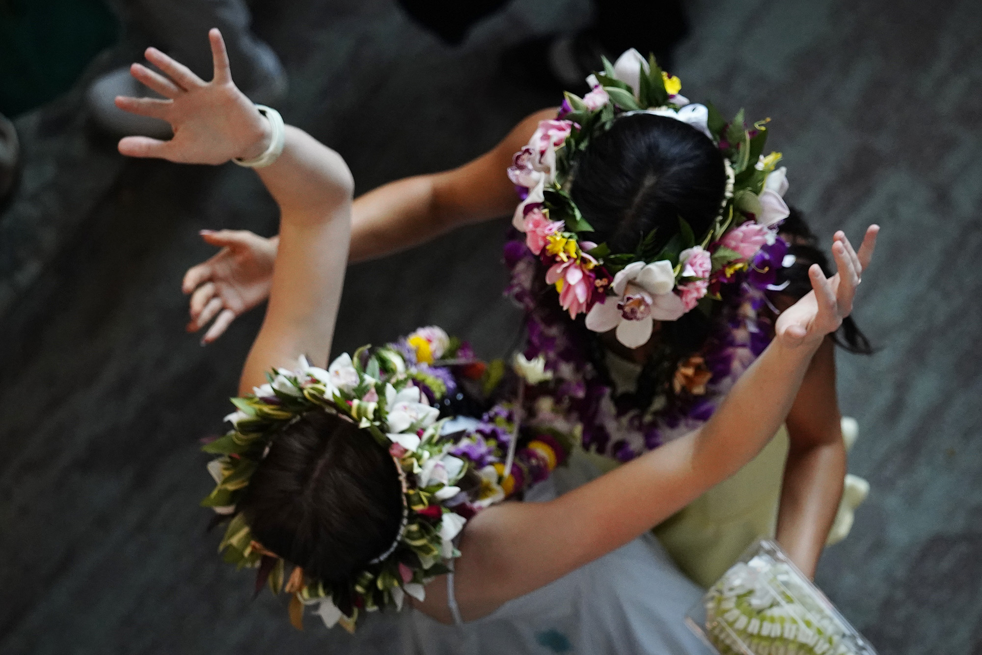 John A. Burns School of Medicine fourth-year students Lily Johnson, left, hugs Hannah Bulosan after receiving their letters for “Match Day” Friday, March 20, 2026, in Honolulu. Both will continue their training in dermatology. Johnson is going to the University of Utah Health while Bulosan and her boyfriend “couples matched” for the University of Washington Medical Center. (Kevin Fujii/Civil Beat/2026)