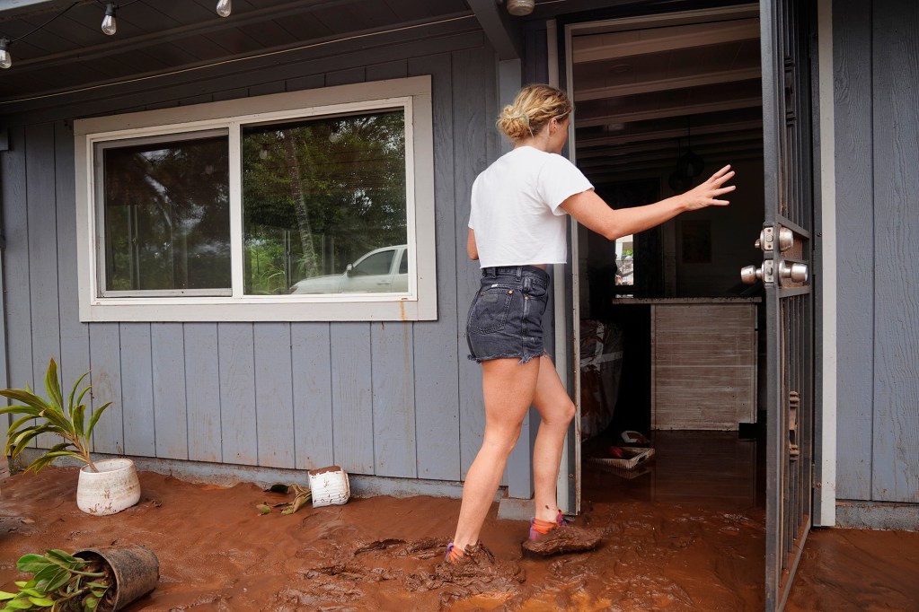India Myercough (808-780-0810) enters her studio Saturday, March 21, 2026, in Waialua. Myercough was flooded by both Kona Low storms. (Kevin Fujii/Civil Beat/2026)