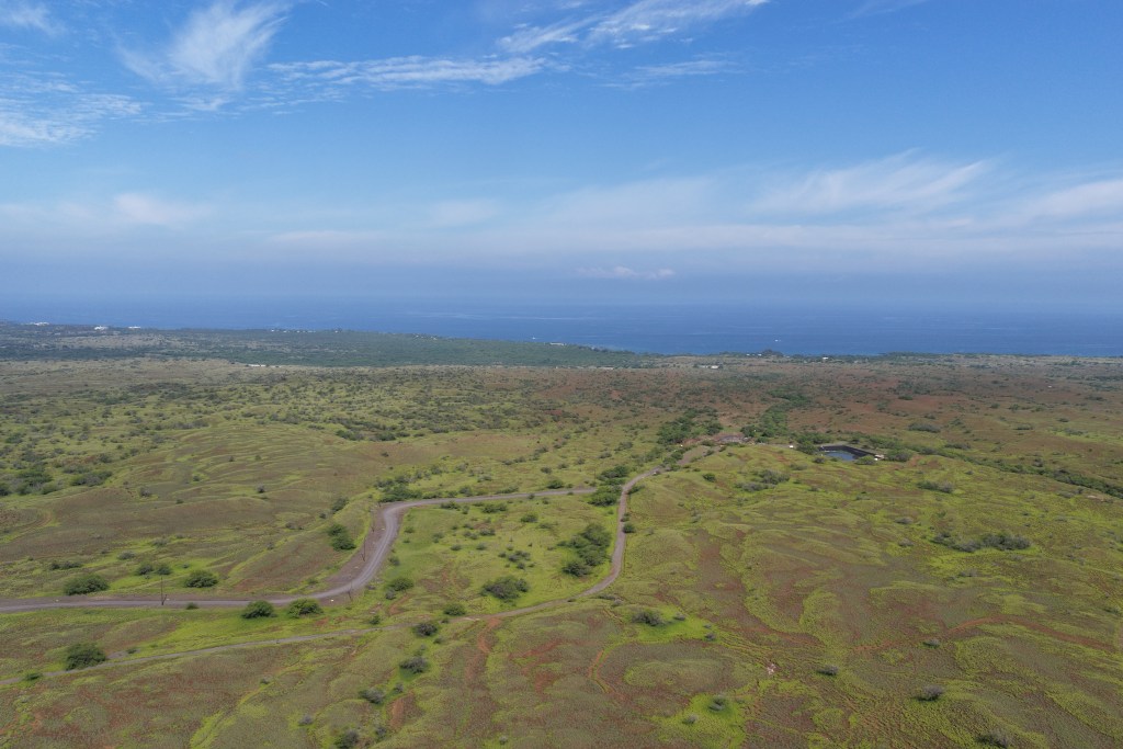 A dirt path bulldozed by the state serves as an evacuation road for fires affecting Waikōloa Village. It runs near the paved county road that serves its wastewater plant. (Courtesy: Matt Chalker)