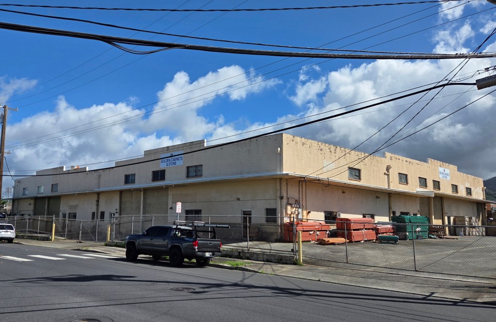 The Golden Cabinets & Stone warehouse on Mookaula Street where Zhenxiong Lin was struck by a falling plank during a renovation project.