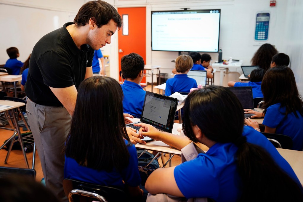 Kūlia Academy math and AI/data science teacher James Morice works with students Thursday, May 7, 2026, in Honolulu. (Kevin Fujii/Civil Beat/2026)