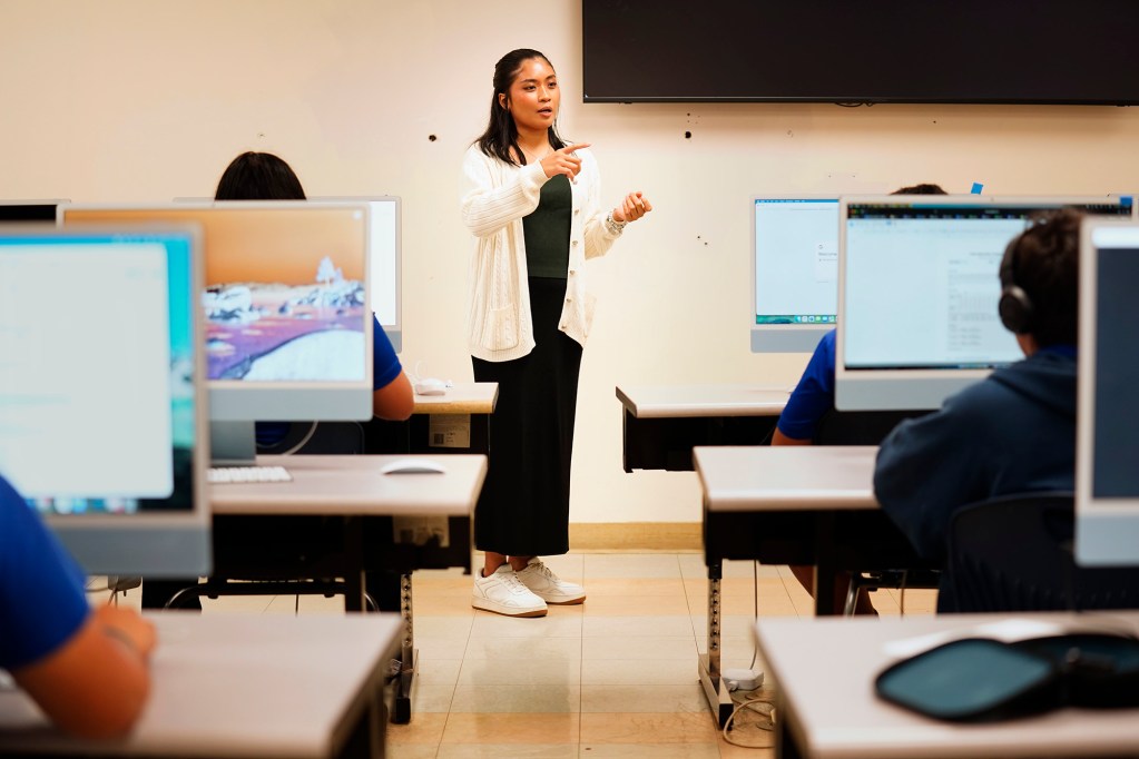 Kūlia Academy teacher Aileen Abitong teaches coding to seventh graders Thursday, May 7, 2026, in Honolulu. (Kevin Fujii/Civil Beat/2026)