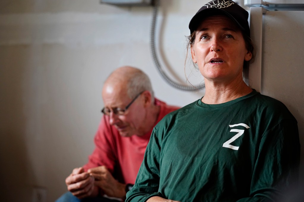 Kainalu Ranch’s Steph Dunbar-Co talks story about Molokaʻi cattle ranchers dealing with the state’s imposed bovine tuberculosis quarantine Wednesday, May 27, 2026, in Kaunakakai. Papohaku Farm’s Jack Spruance listens in. (Kevin Fujii/Civil Beat/2026)