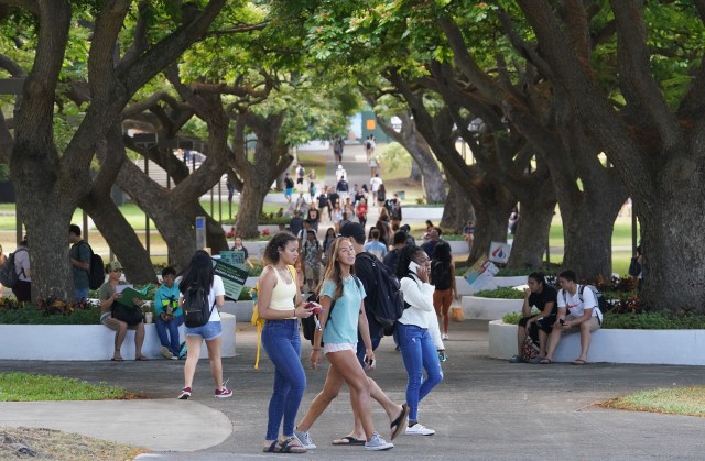 Students walk across the mall area of the University of Hawaii at Manoa.