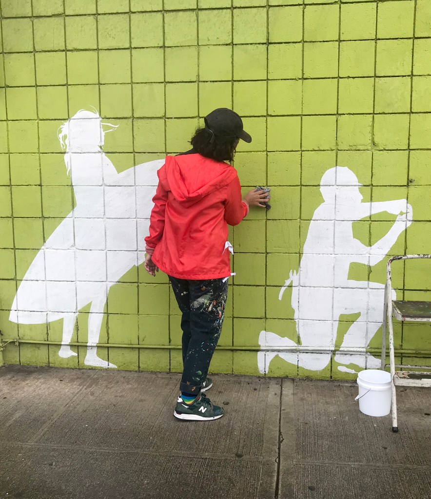 Crisselle Mendiola works on a mural in Honolulu's Kakaako district as part of the 2020 Pow! Wow! Hawaii's 10th annual festival on Monday, February 10. 2020.  Both local and international artists will spend the next week decorating walls of Kakaako neighborhoods with their larger than life artwork. 