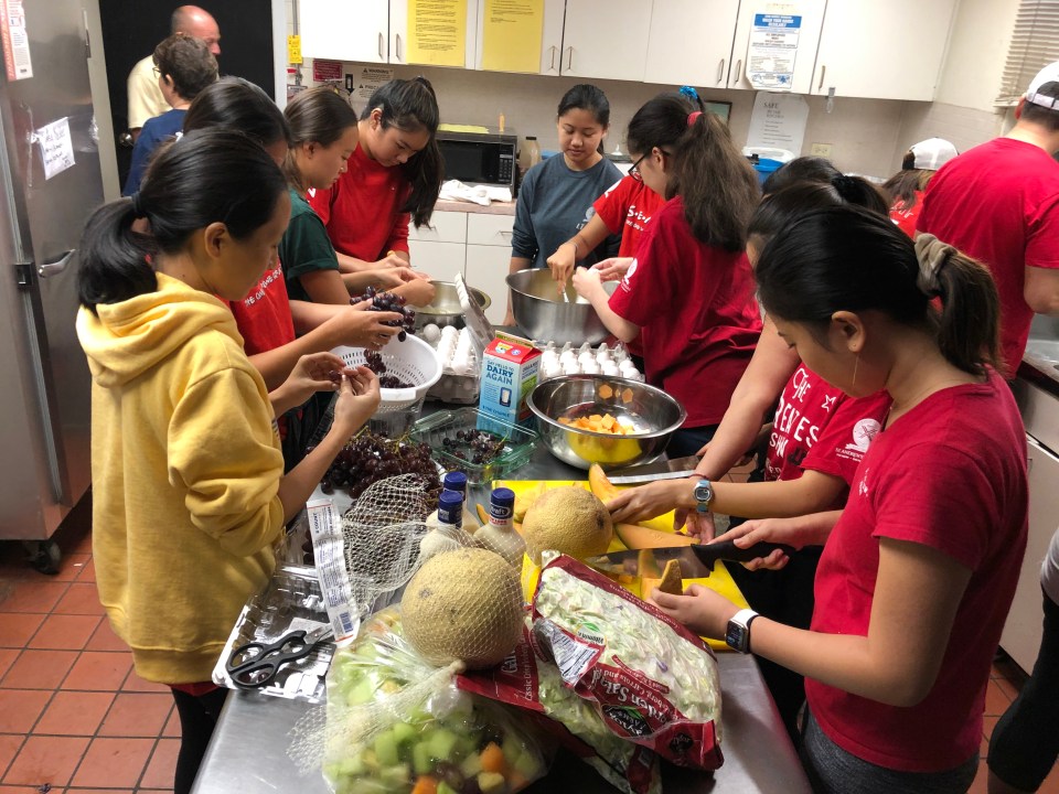 young volunteers from St. Andrew's Priory helping with the weekly Saturday hot breakfasts that St. Elizabeth's Episcopal Church provides to the hungry