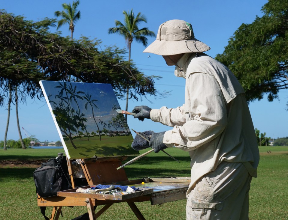Painter David Luchak, works on a landscape oil painting at Neal S. Blaisdell Park in Aiea, Sat March 14, 2020. Luchak was part of a group of artists gathering at the park to paint together for the day. (Ronen Zilberman photo Civil Beat)