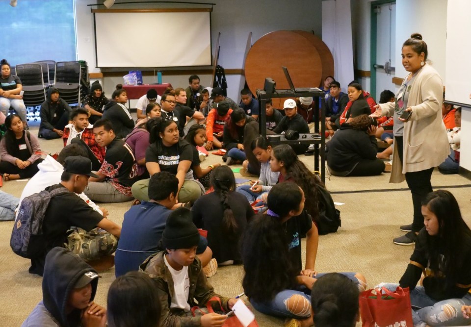 Hermaleen Amond, right, discusses how youth can empower themselves today to prepare for future success, with micronesian high school students from around the Hawaiian Islands, during the 4th annual Micronesian Youth Summit held at the University of Hawaii Manoa campus in Honolulu, on Saturday, March 7, 2020.  (Ronen Zilberman photo Civil Beat)