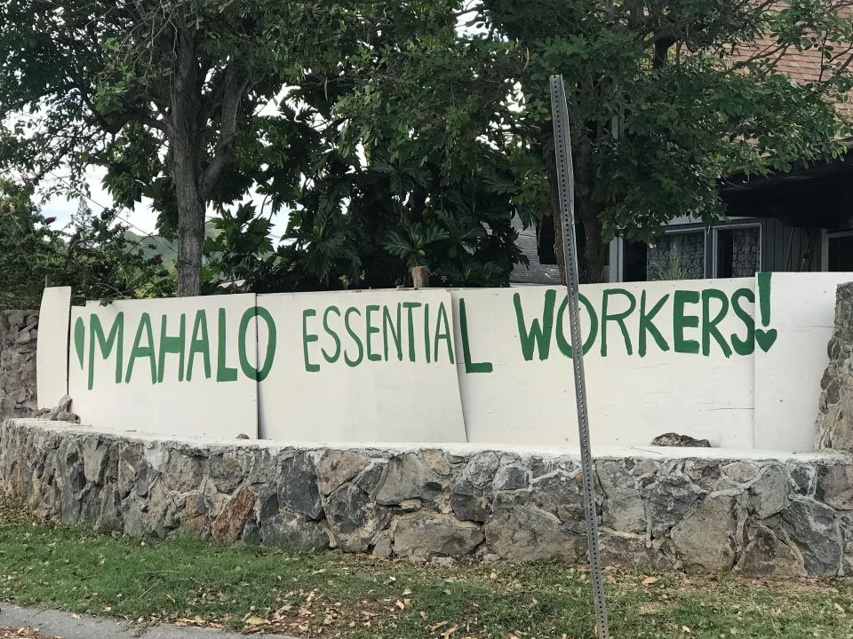 A homemade sign on a homeowner's wall fronting Oneawa Street in Kailua celebrates Hawaii's everyday workforce.