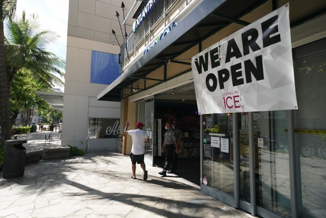 Waikiki during COVID19 pandemic ‘We Are Open’ with shops posting large banners along Kalaukaua Avenue. July 10, 2020