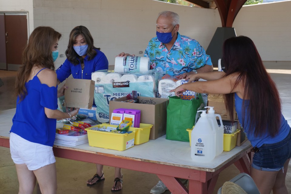 Volunteers organizing school supplies during inaugural senator Breene Harimoto school supply fund drive in Pearl City.  Sunday, Sept. 26, 2020. (Photo: Ronen Zilberman/Civil Beat)