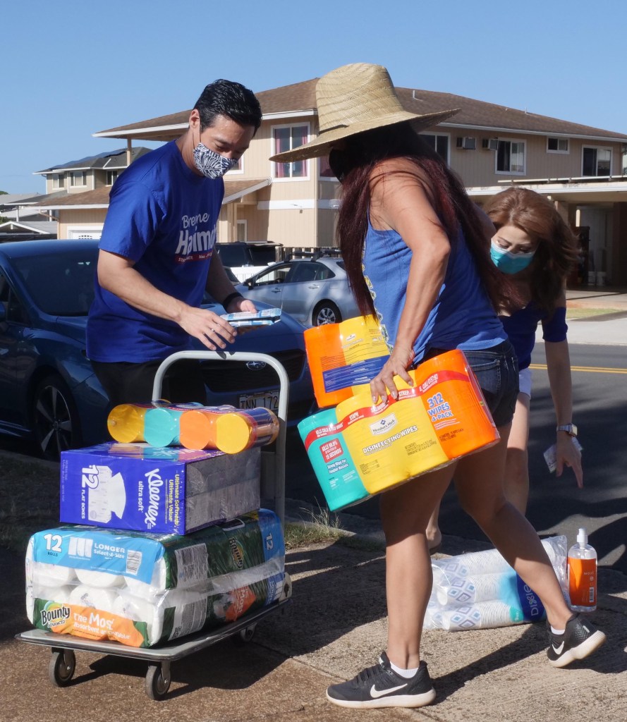 Volunteers loading cleaning supplies during inaugural senator Breene Harimoto school supply fund drive in Pearl City.  Sunday, Sept. 26, 2020. (Photo: Ronen Zilberman/Civil Beat)