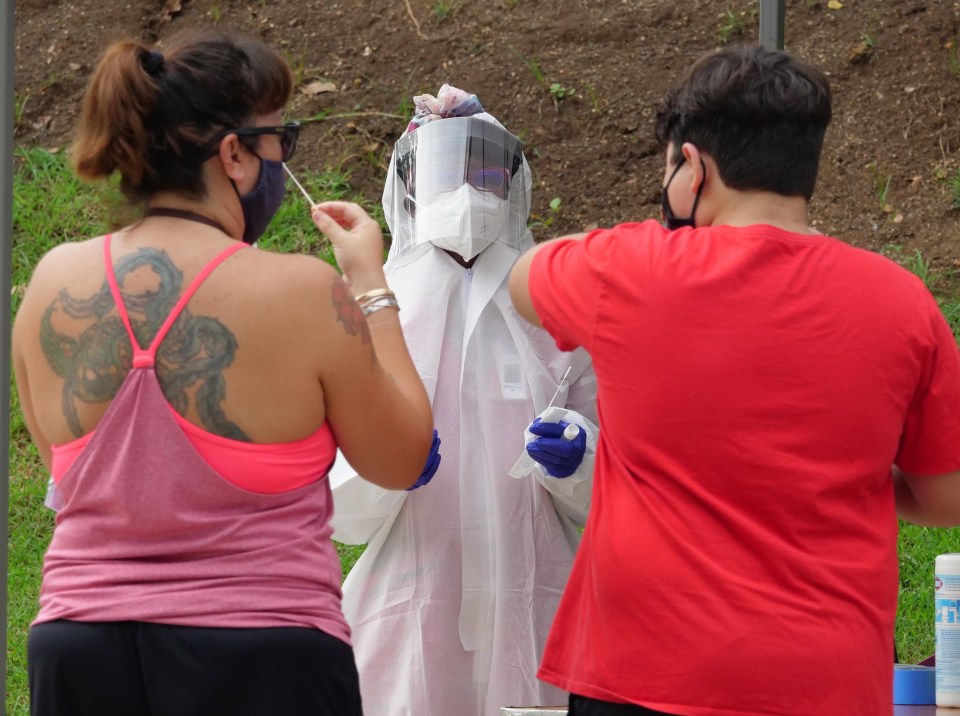 Medical personnel assist those who show up for free COVID-19 testing at the Waikiki Shell on October 17, 2020. (Ronen Zilberman photo Civil Beat)