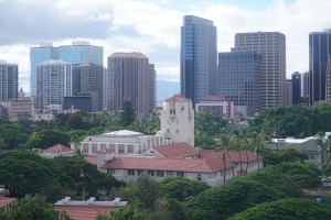 Honolulu Hale the skyline of downtown buildings in the background.