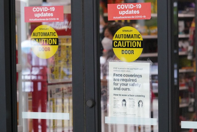 'Face coverings required' sign at the entrance to Long's located at Ala Moana Center.